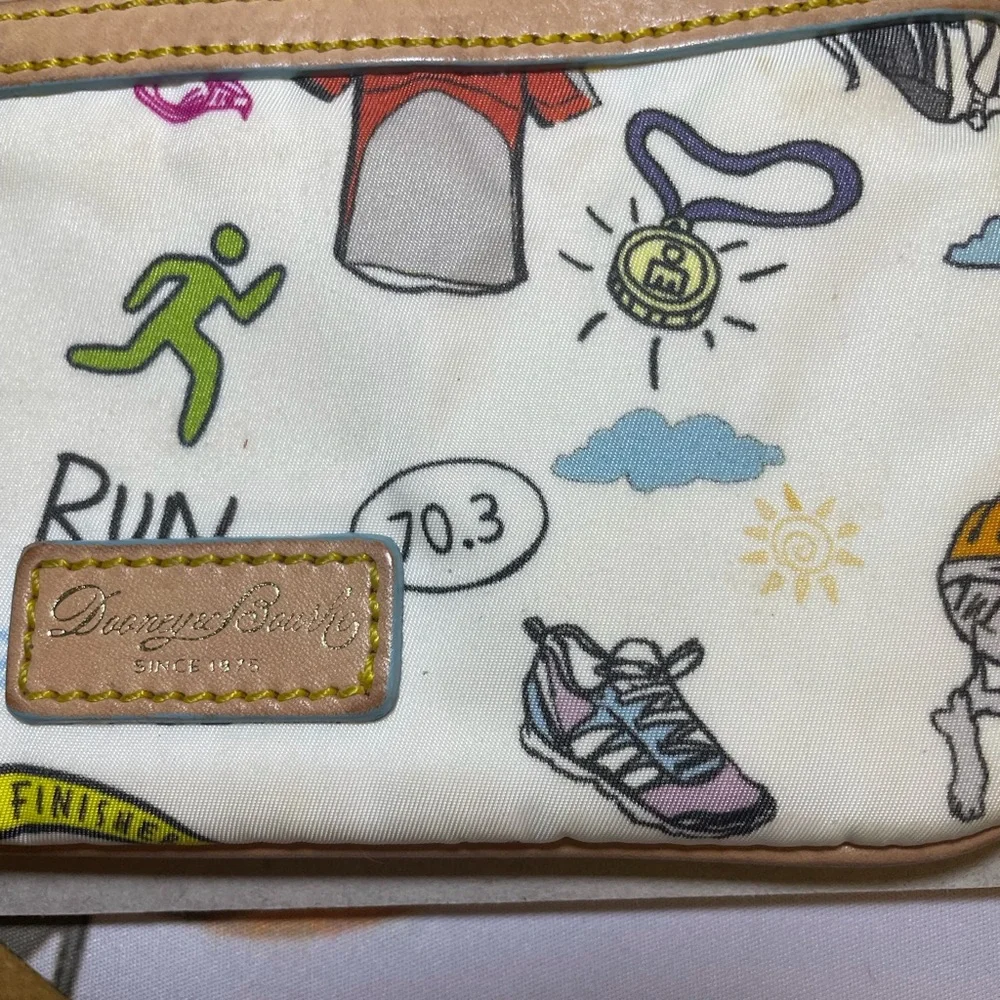 Dooney & Bourke Disney Sketch Marathon Wristlet 70.3 Run is a small wristlet